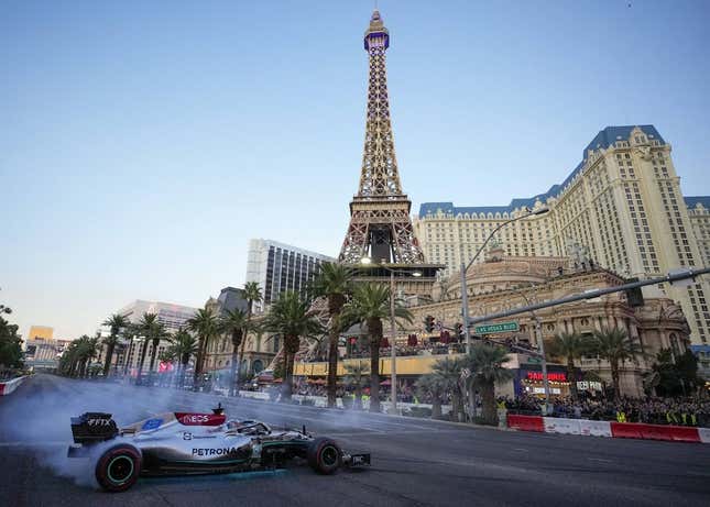 Nov 5, 2022; Las Vegas, Nevada, USA;  Mercedes-AMG Petronas driver George Russell spins his car on the track during the Formula One Las Vegas Grand Prix Launch Party at Las Vegas Strip.