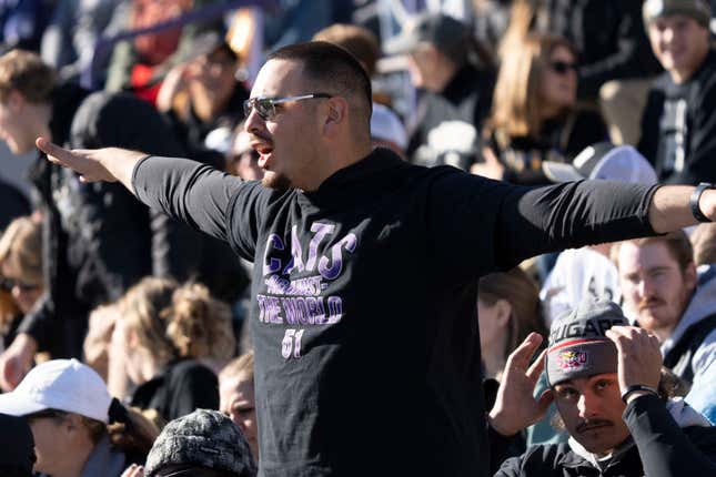 Northwestern fan wears ‘Cats against the world’ shirt at game against Purdue.