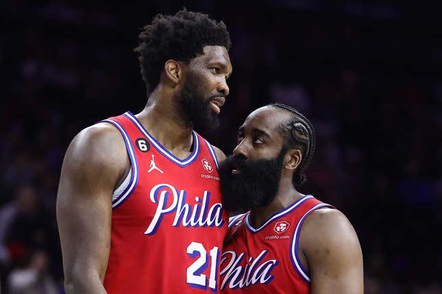 PHILADELPHIA, PENNSYLVANIA - DECEMBER 23: Joel Embiid #21 and James Harden #1 of the Philadelphia 76ers speak during the fourth quarter against the LA Clippers at Wells Fargo Center on December 23, 2022 in Philadelphia, Pennsylvania. NOTE TO USER: User expressly acknowledges and agrees that, by downloading and or using this photograph, User is consenting to the terms and conditions of the Getty Images License Agreement. (Photo by Tim Nwachukwu/Getty Images)