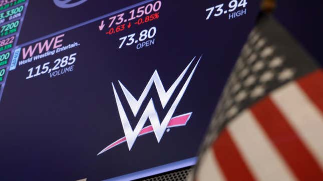 The logo for World Wrestling Entertainment, WWE, appears above a trading post on the floor of the New York Stock Exchange