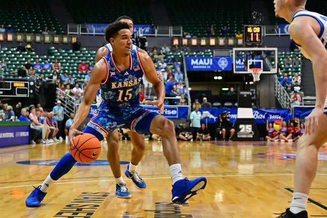 Nov 20, 2023; Honolulu, Hawaii, USA;  Kansas Jayhawks guard Kevin McCullar Jr. (15) drives to the basket against Chaminade Silverswords forward Scott Ator (24) during the first period at SimpliFi Arena at Stan Sheriff Center.